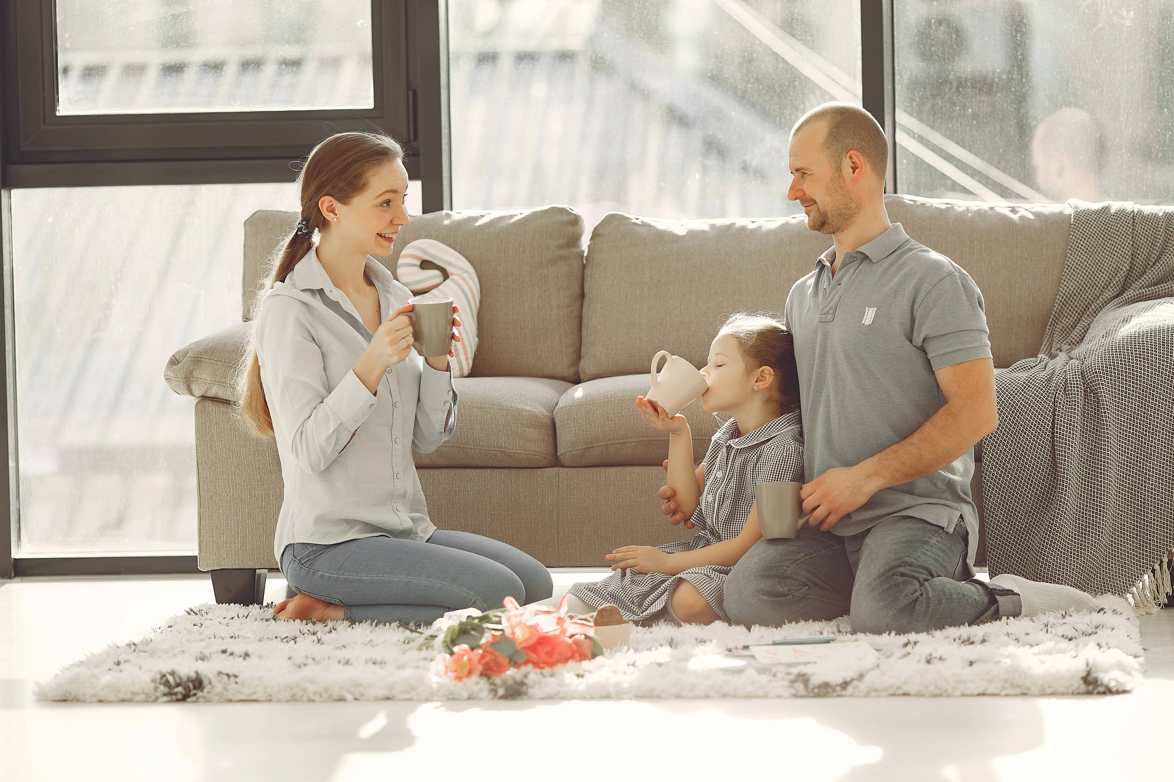 Family laughing together in a comfortable living room