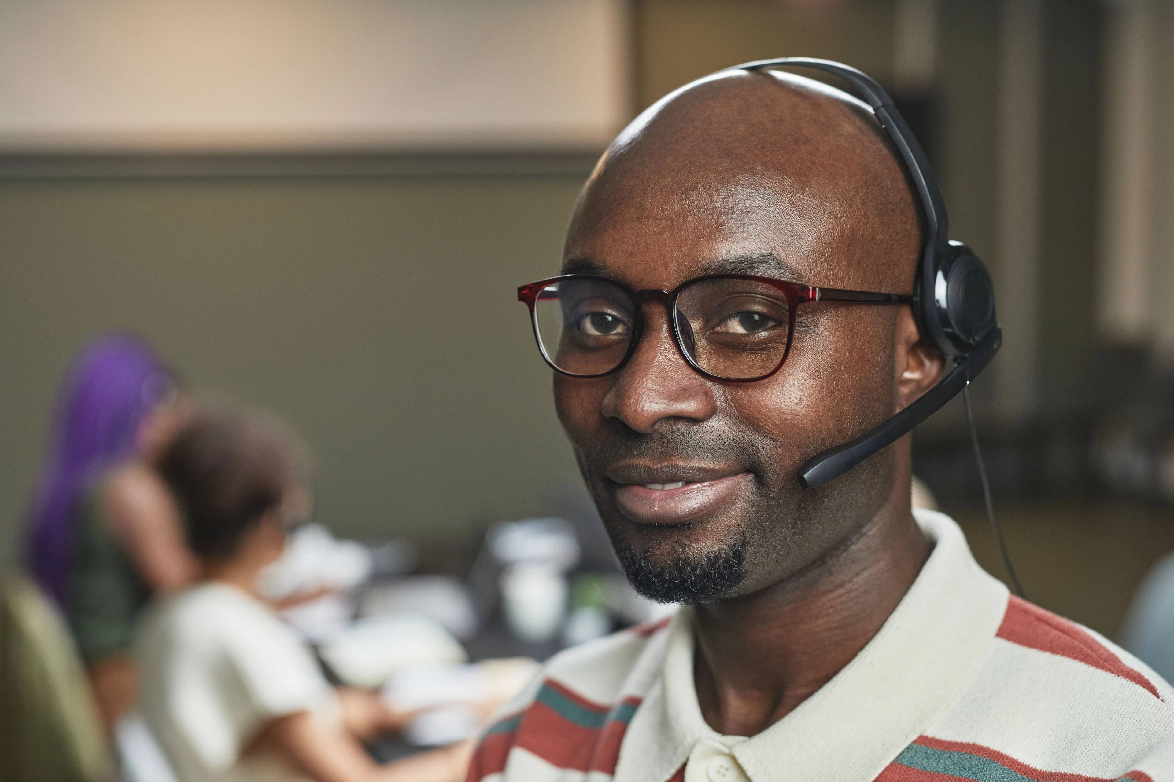 Smiling customer service rep wearing a headset